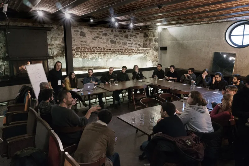 Participants around the tables at the Algorithm Community Workshop